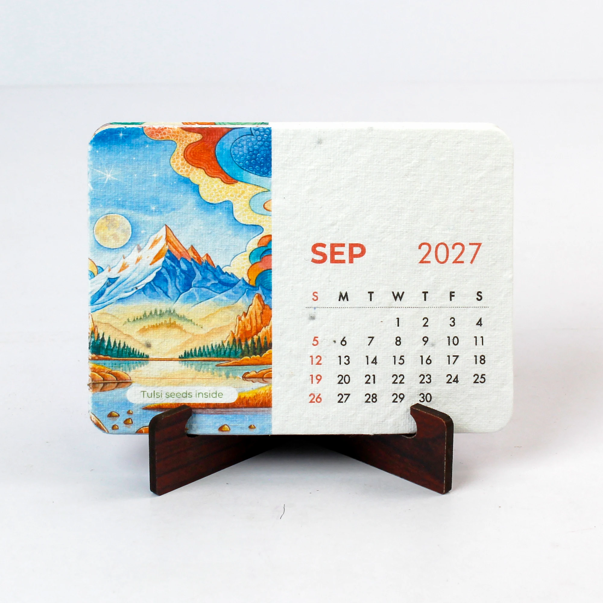 Front view of BG60 September 2027 B7 seed-paper card on its dark MDF stand