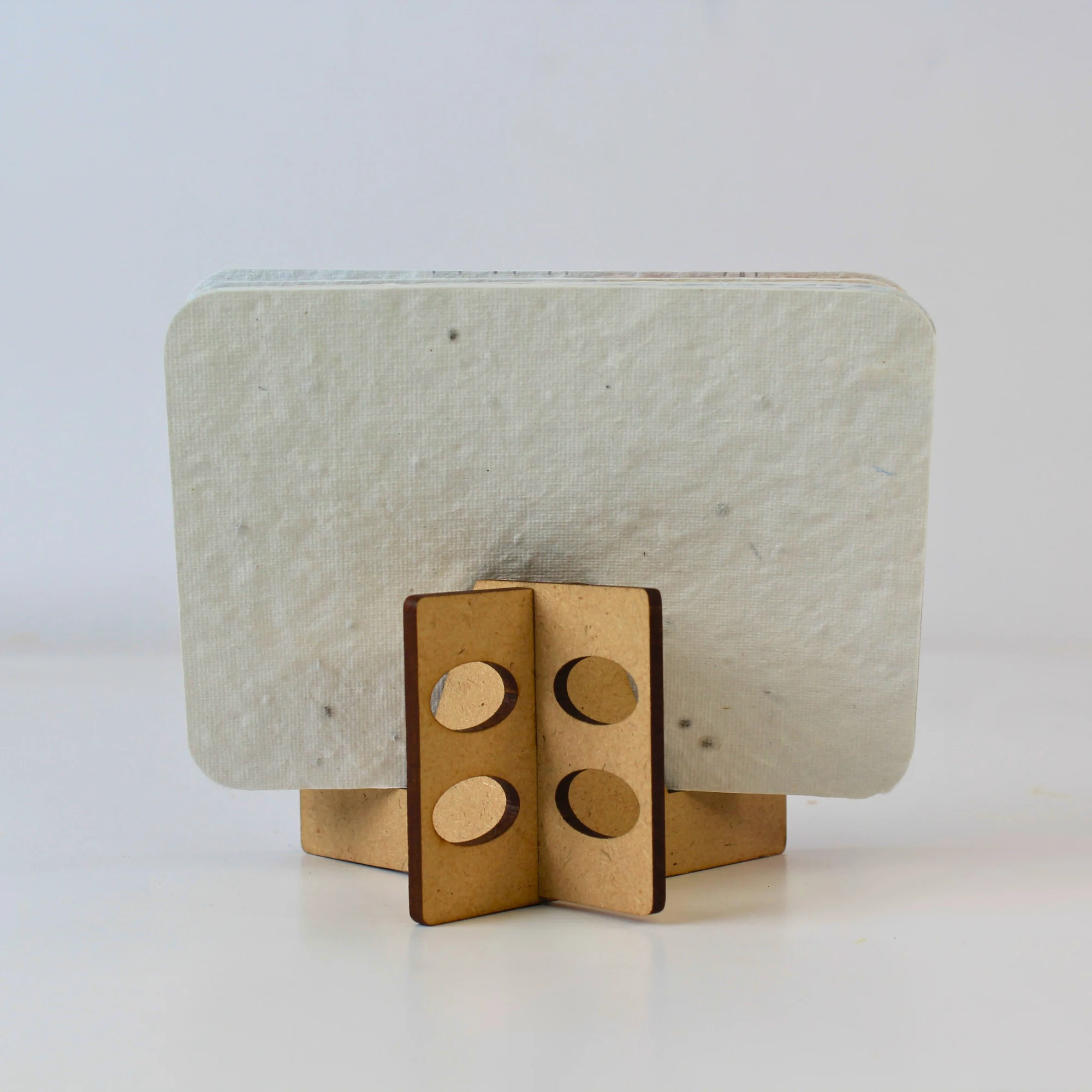 Back view of the BG60 seed-paper card stack and interlocking MDF desk stand