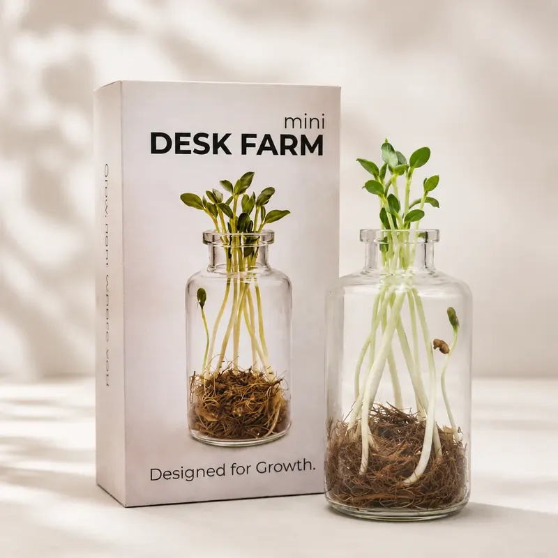 DeskFarm Mini glass vials with sprouting seeds beside printed packaging