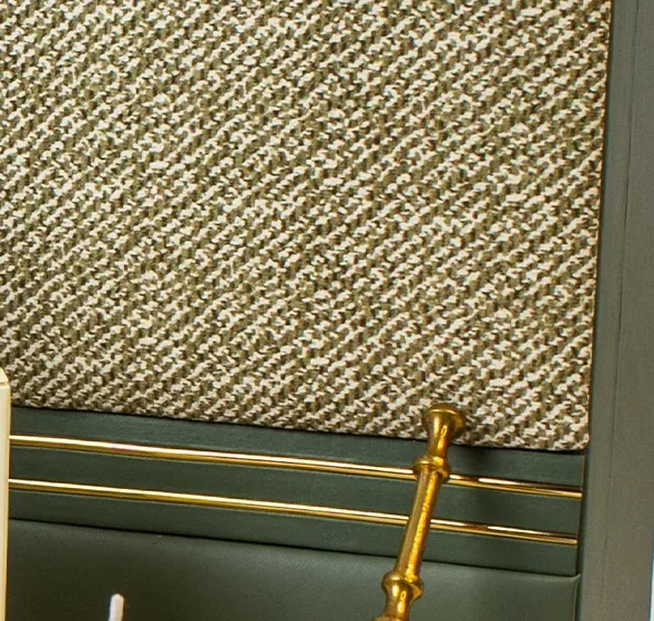 The cushioned woven-fabric lid of the Emerald Forest Chest with its twin gold lines