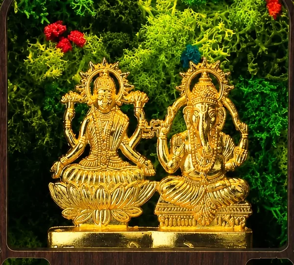 Close-up of the Laxmi and Ganesh idols and the preserved moss around them