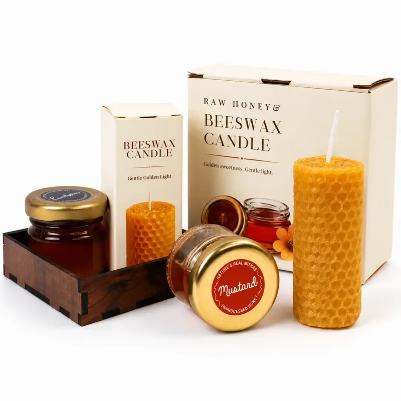 Raw honey jars and a beeswax candle presented in a gift tray