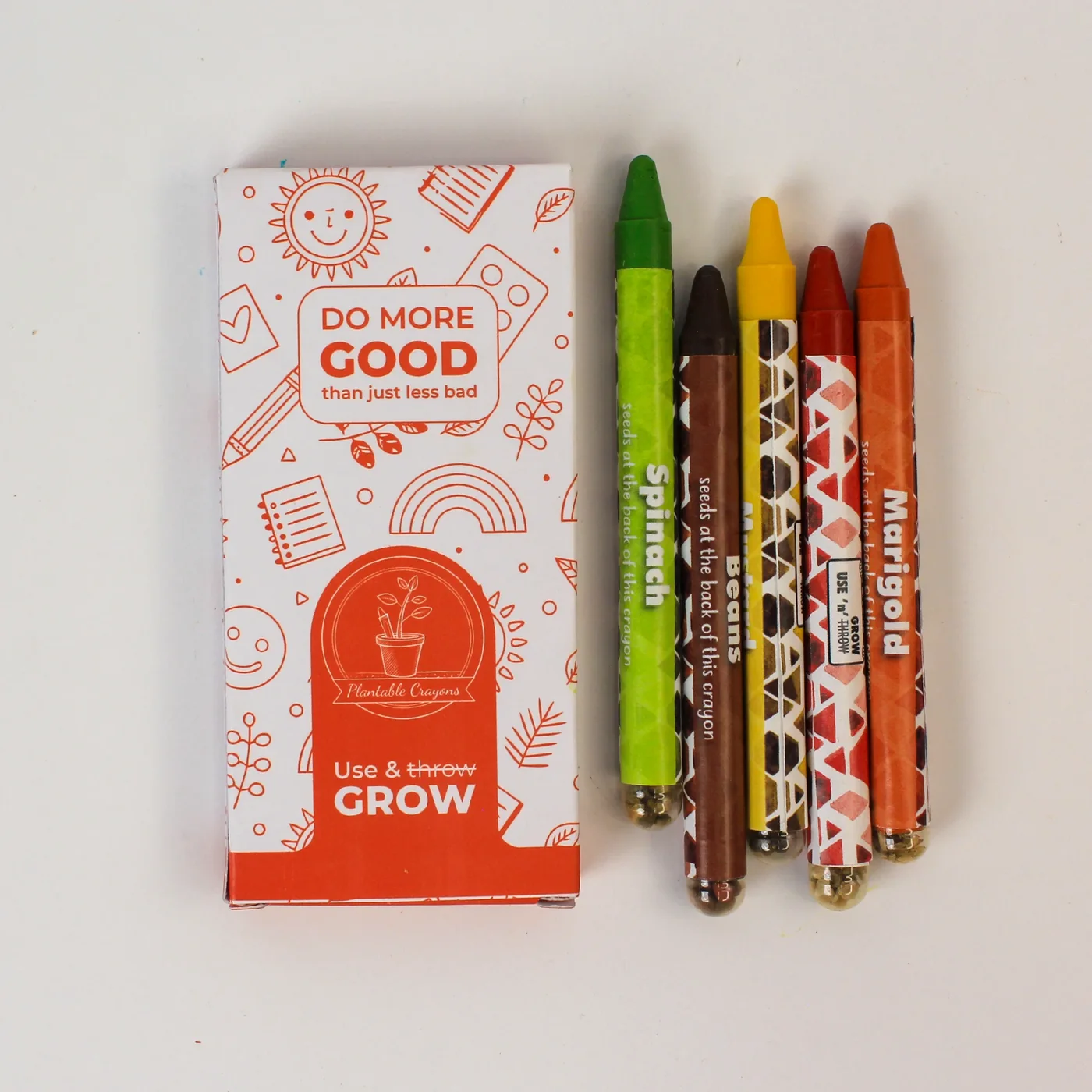 5LG06 printed crayon box beside five plantable wax crayons named spinach, marigold and other seeds