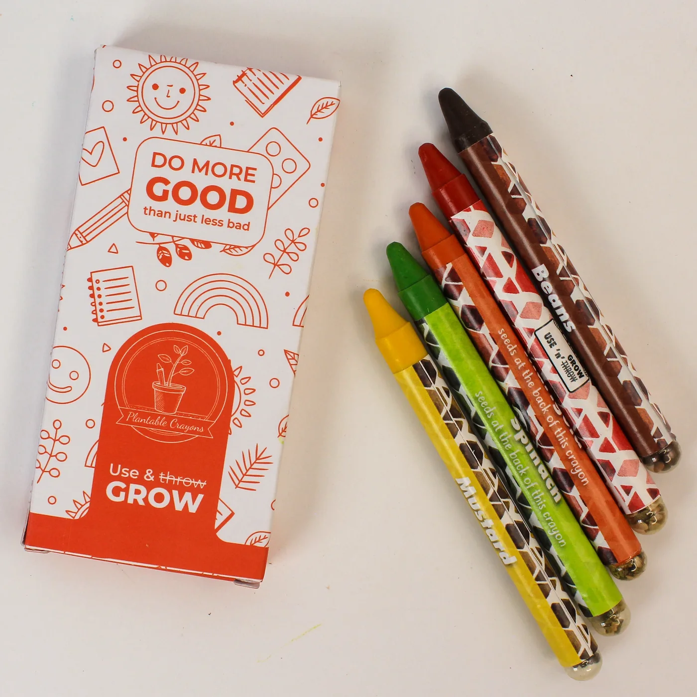 Five 5LG06 plantable crayons fanned out beside their printed box