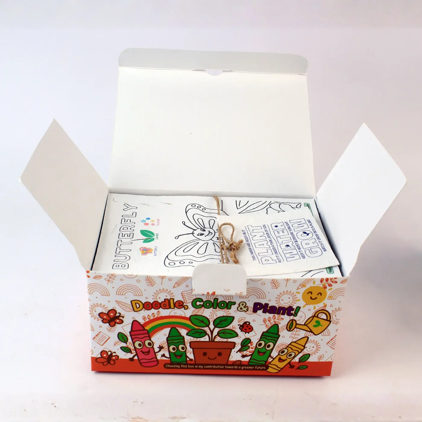 The DG30 kit from above, packed, with the seed-paper colouring sheets on top
