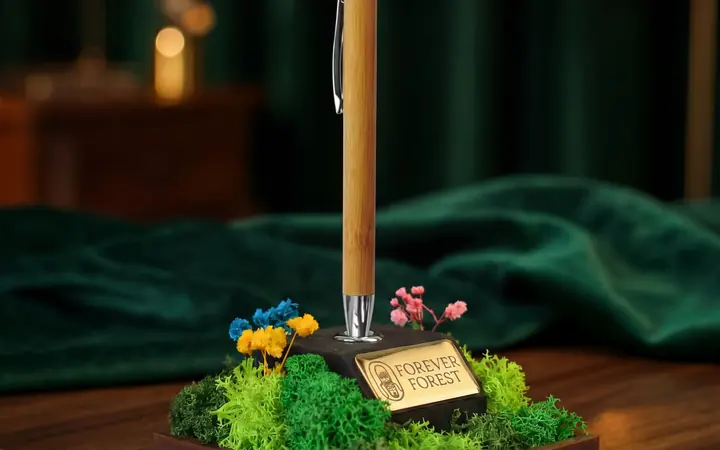Forest Quill pen stand with preserved moss and an engraved nameplate