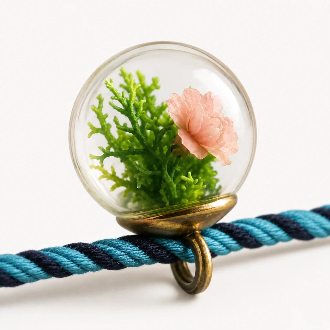 Ocean Breeze Forest Thread rakhi with a real preserved botanical pendant