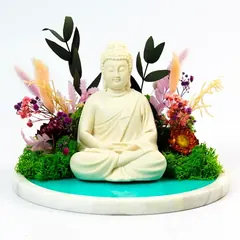 Buddha on marble in a forest scene