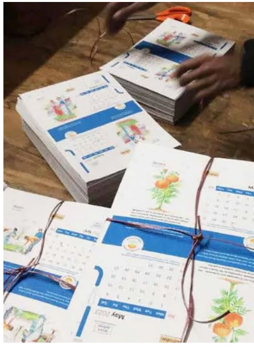 Printed seed-paper sheets being cut and tied into sets