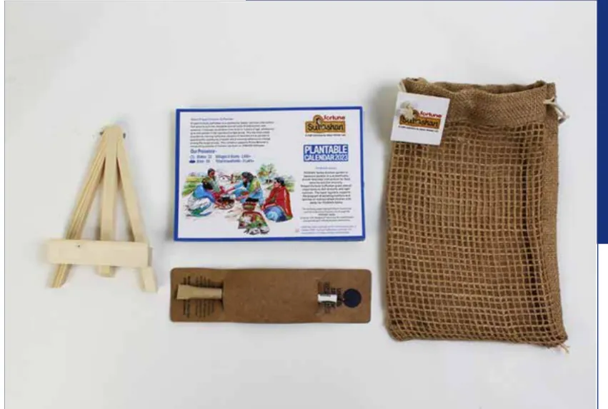The kit laid out: wooden easel, pen, jute bag and the calendar