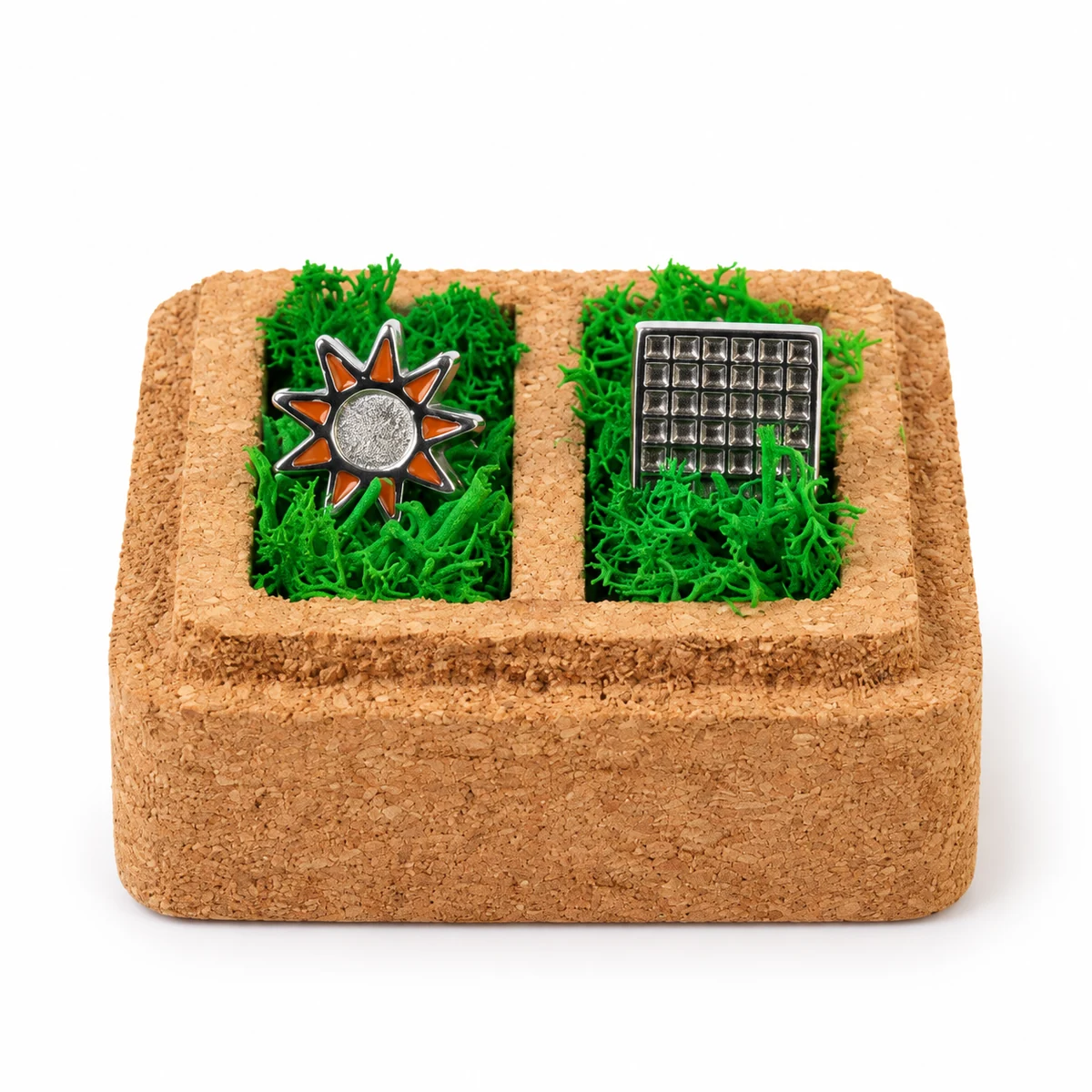 Front view of the cork box with cufflinks held in two preserved-moss-lined wells