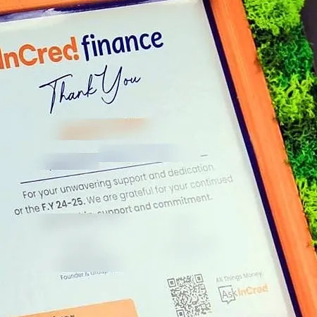 The certificate inside the frame, with the name blurred
