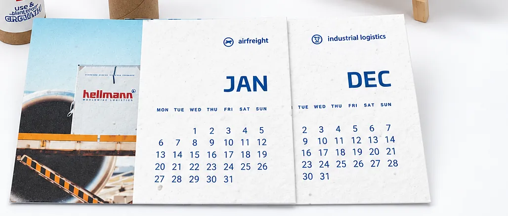 The January and December cards laid flat, with a photograph of a container yard
