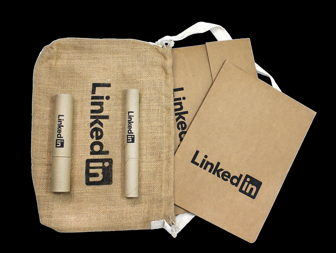 Pink cotton sling bags and printed cards with the client’s mark