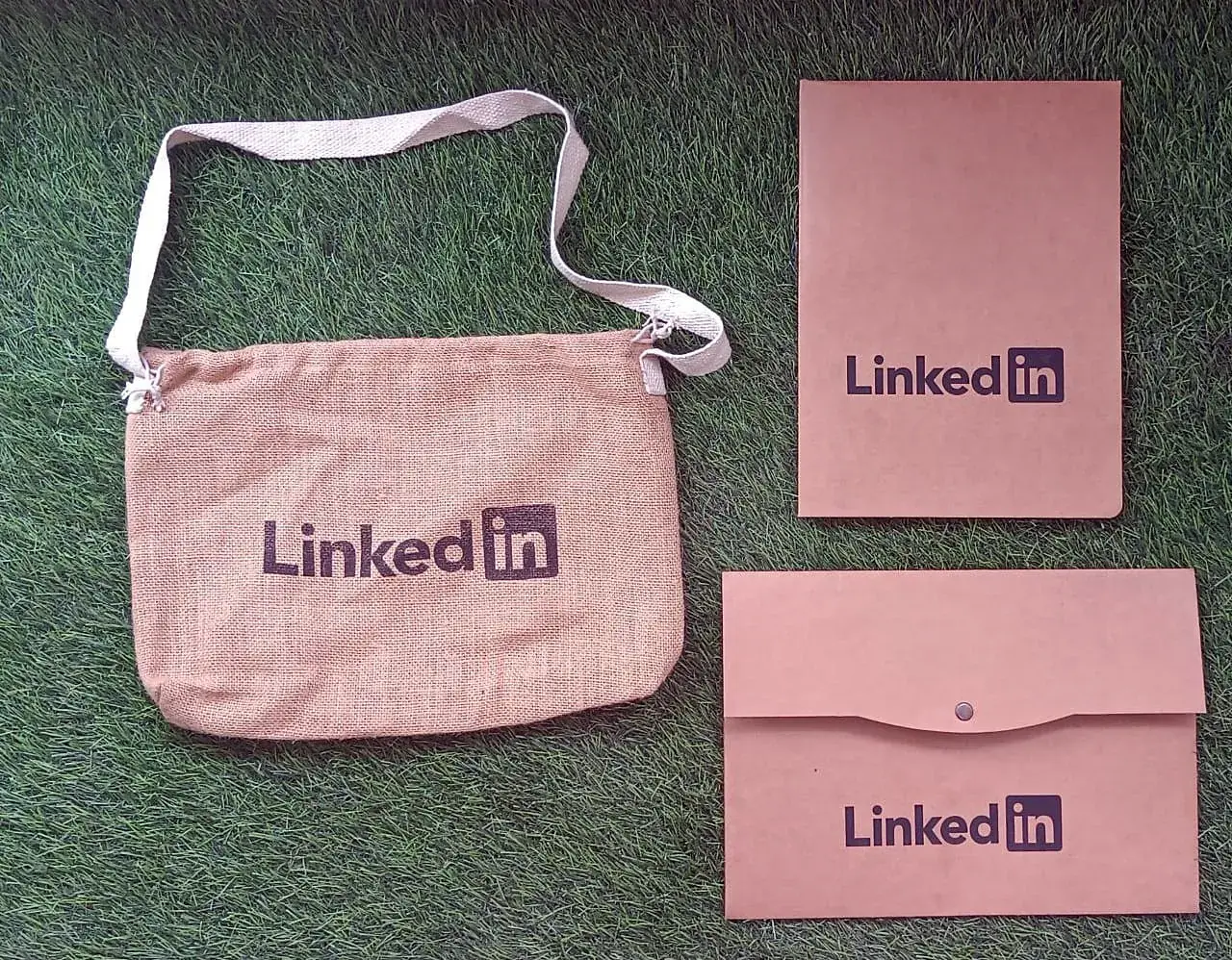 A jute bag and kraft pouches with the client-printed paper tubes