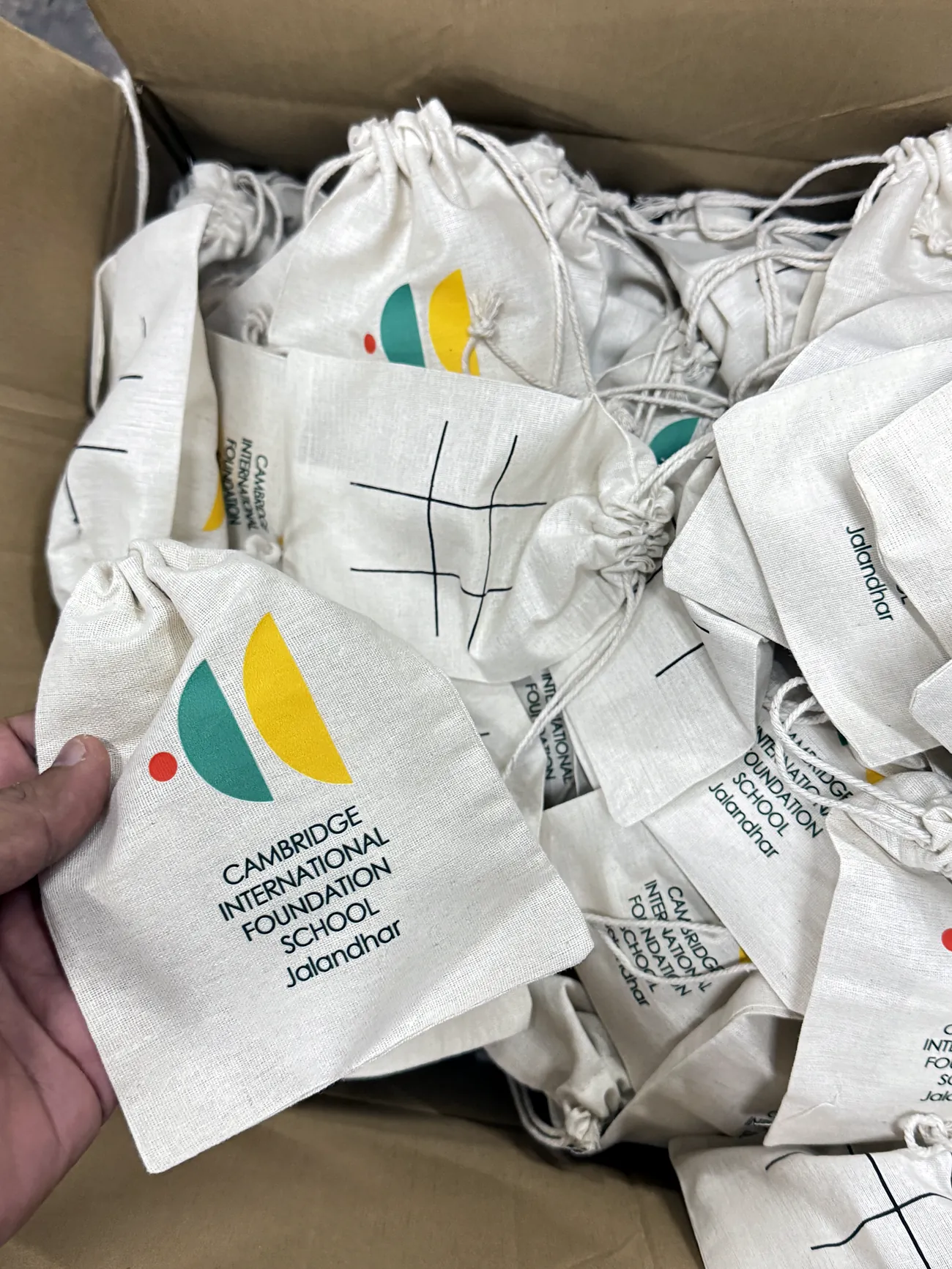 Printed cotton bags piled in a carton