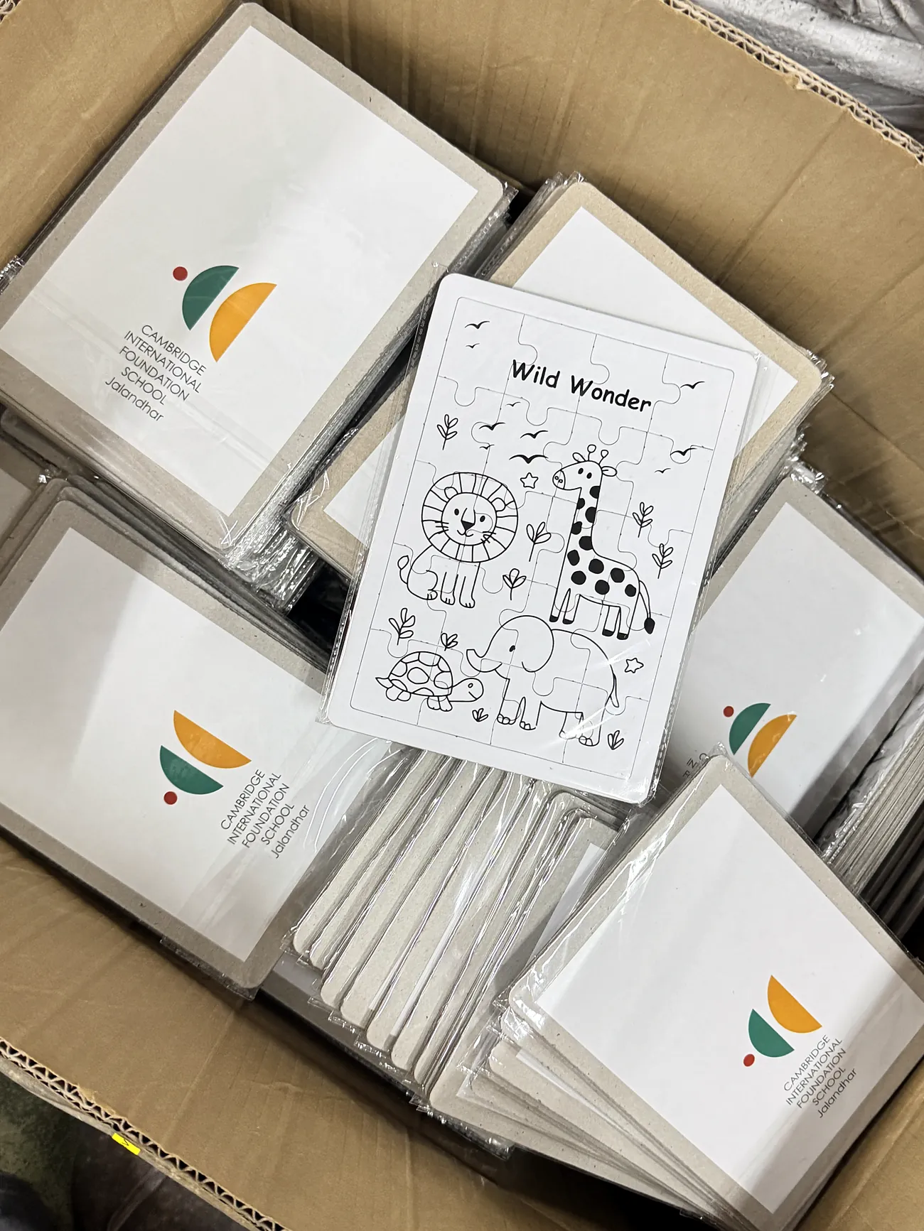 Stacks of wrapped colouring puzzles
