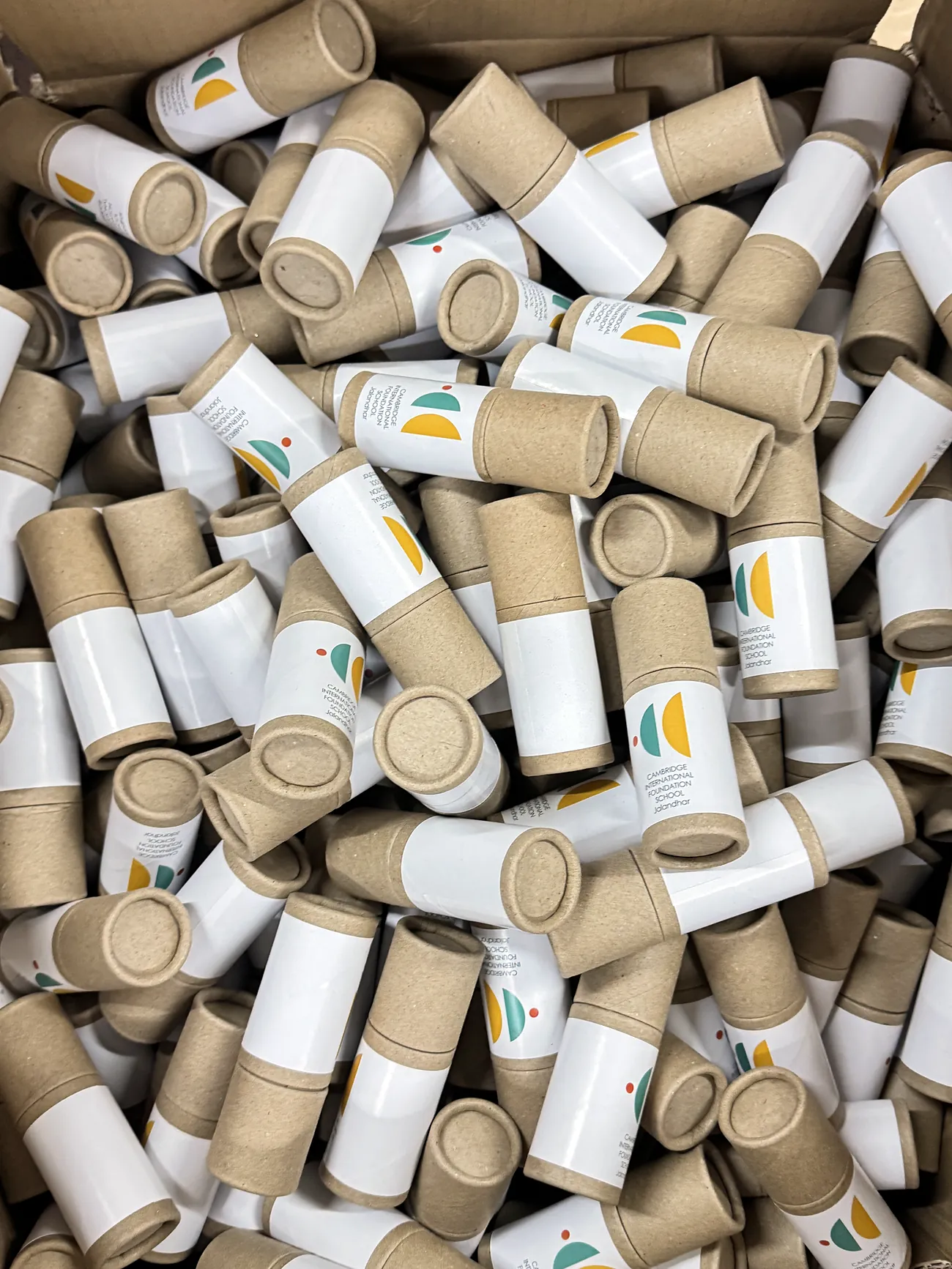 Hundreds of printed kraft tubes in a crate
