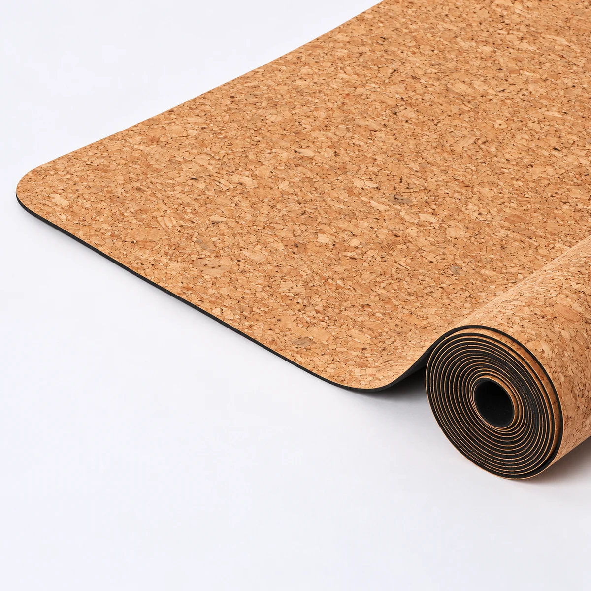 A cork mat shown rolled for storage