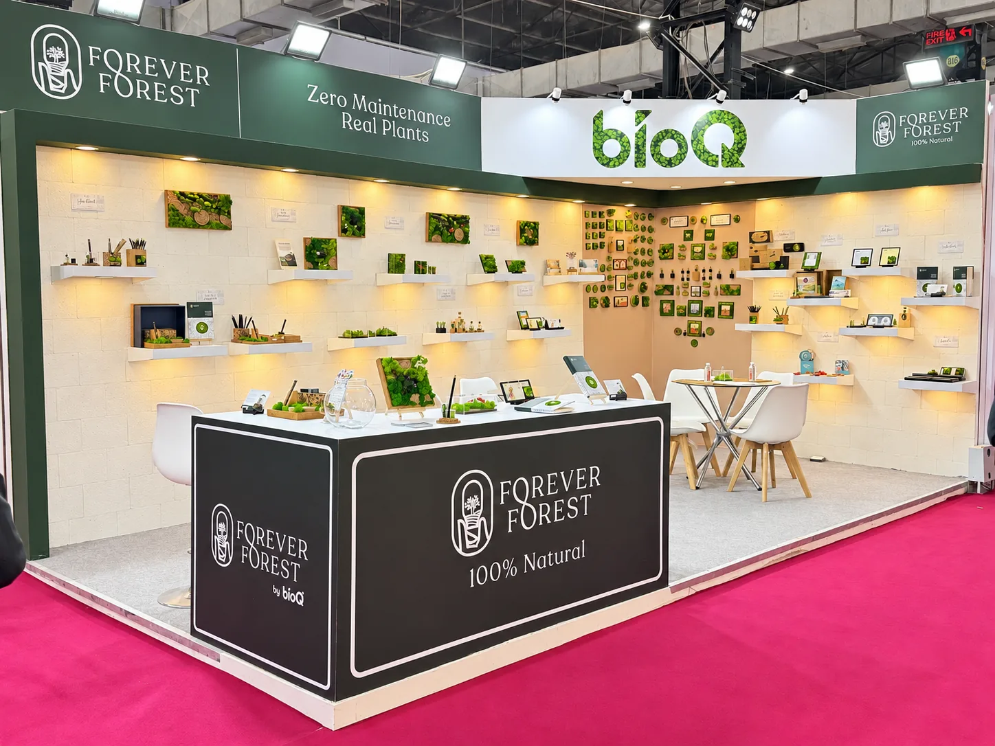 The green and white Forever Forest stall at Paperworld India, with the bioQ sign overhead