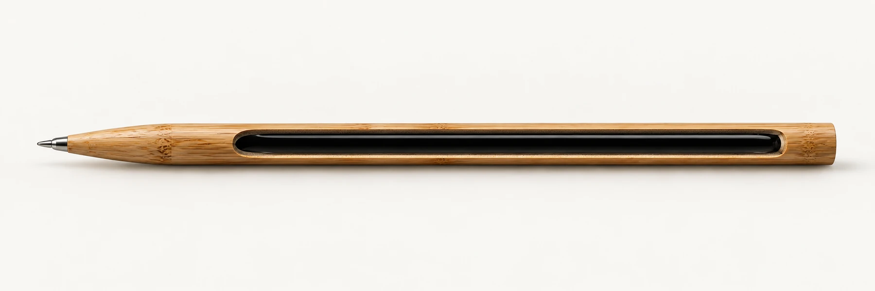 Concept longitudinal cutaway showing the ink reservoir within the bamboo body and the metal ballpoint tip at the writing end.
