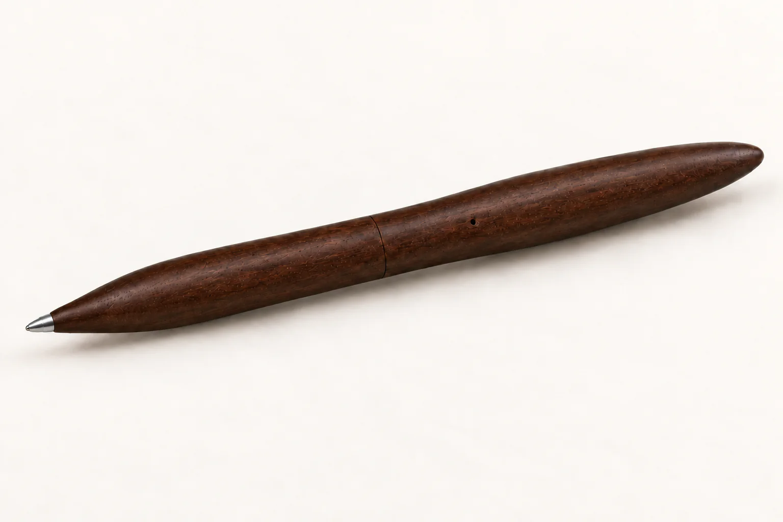 Design render of the assembled dark wood pen, showing its exposed metal writing tip, flush middle joint, side vent and rounded tail.